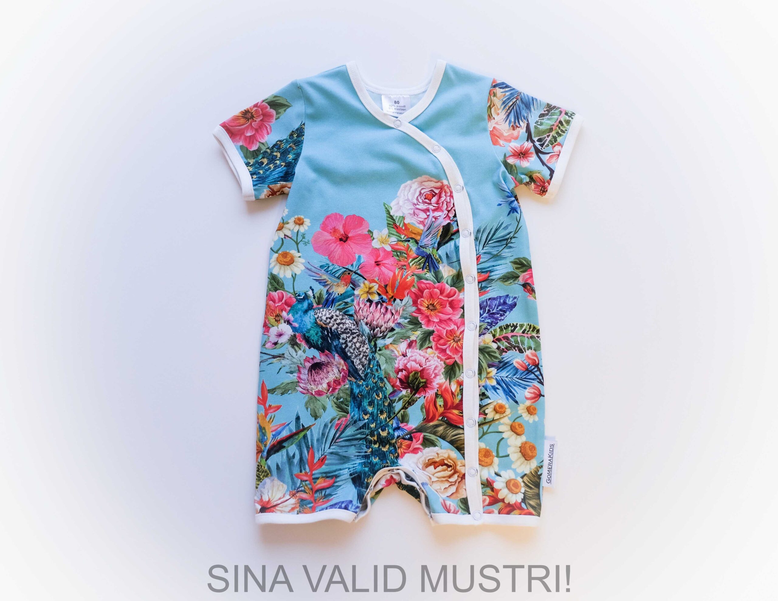 GOMERA Mini tellimustööna valmiv lühikeste varrukatega suvine beebi romper. Lilleline Eesti käsitöö beebiriided.